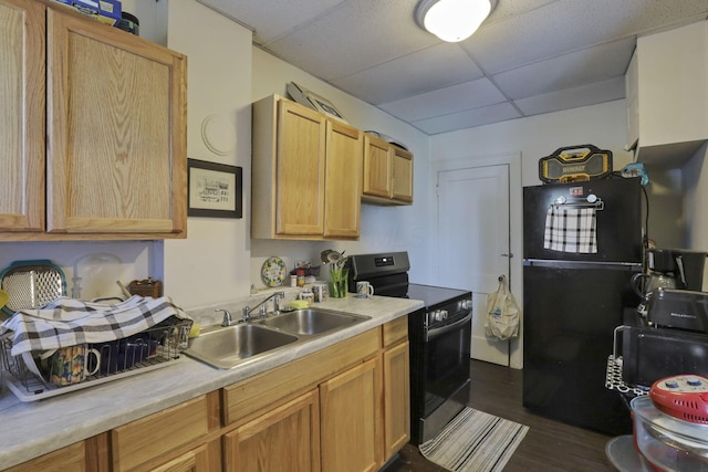 635-641 Racine Ave, Columbus, OH 43204 - kitchen featuring electric range oven, a paneled ceiling, freestanding refrigerator, light countertops, and dark wood-style floors