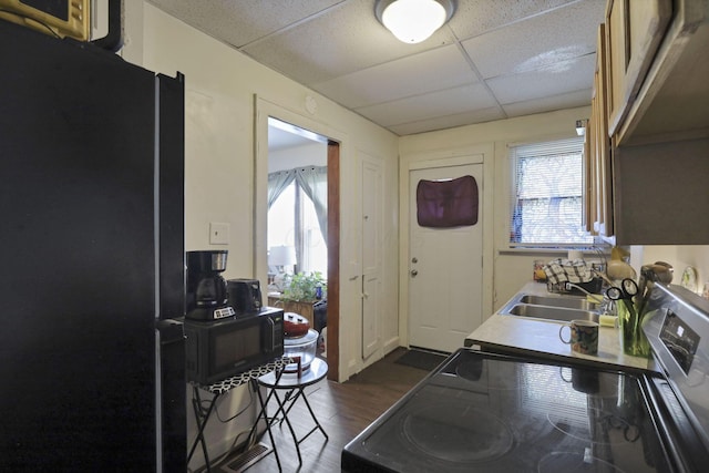 635-641 Racine Ave, Columbus, OH 43204 - kitchen with black appliances, dark wood-type flooring, and a drop ceiling