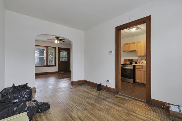635-641 Racine Ave, Columbus, OH 43204 - unfurnished living room with arched walkways and dark wood-type flooring
