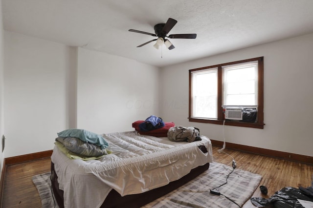635-641 Racine Ave, Columbus, OH 43204 - bedroom with cooling unit, a ceiling fan, and wood finished floors