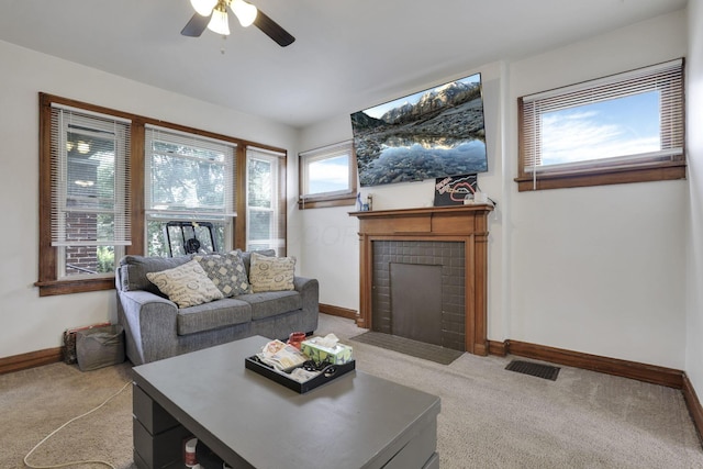 635-641 Racine Ave, Columbus, OH 43204 - living room featuring a fireplace with flush hearth, light colored carpet, and a ceiling fan