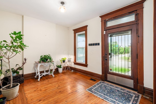 572 Linwood Ave, Columbus, OH 43205 - foyer entrance featuring hardwood / wood-style floors and baseboards
