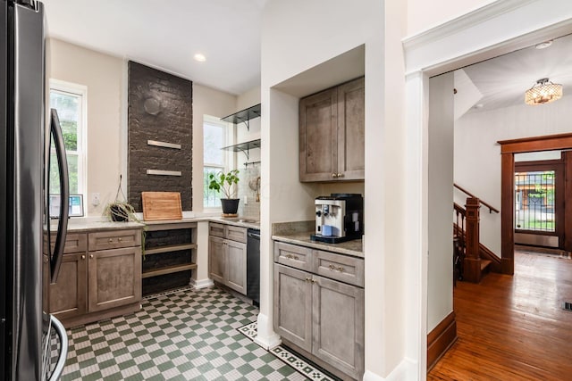 572 Linwood Ave, Columbus, OH 43205 - kitchen featuring freestanding refrigerator, healthy amount of natural light, and light stone counters