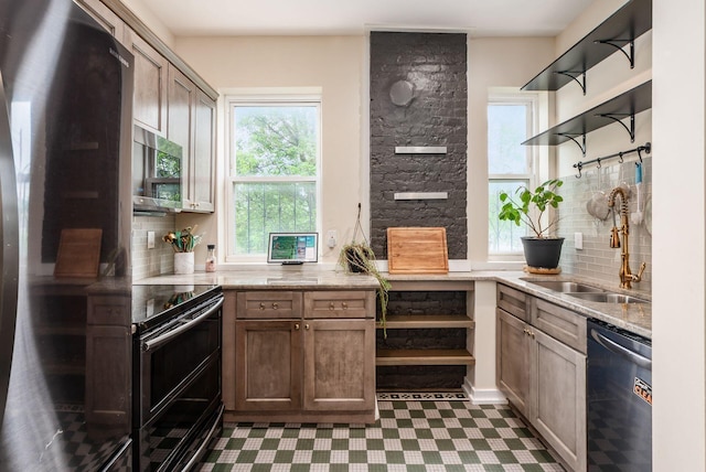 572 Linwood Ave, Columbus, OH 43205 - kitchen with stainless steel appliances, tasteful backsplash, tile patterned floors, and light stone counters