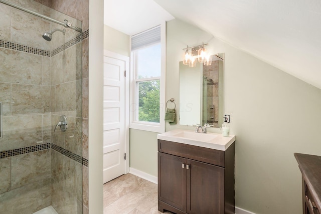 572 Linwood Ave, Columbus, OH 43205 - full bathroom featuring vanity, vaulted ceiling, and a shower stall