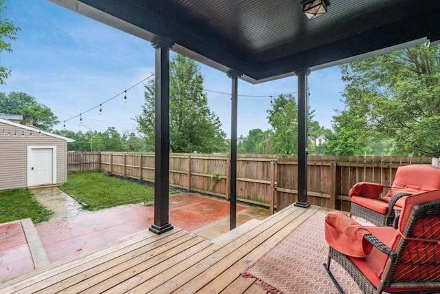 572 Linwood Ave, Columbus, OH 43205 - wooden deck featuring a fenced backyard, a patio area, and an outdoor structure