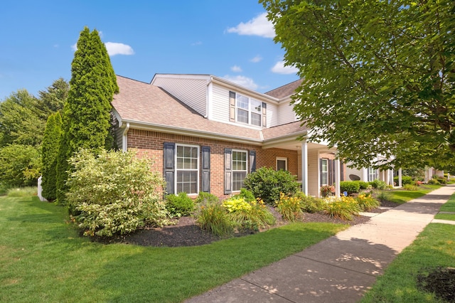 5928 Treven Way, Westerville, OH 43081 - view of front of property featuring a front yard, brick siding, and roof with shingles
