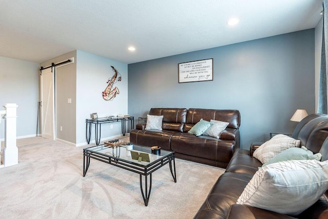 123 Schellinger St, Delaware, OH 43015 - living room featuring a barn door, carpet, and recessed lighting