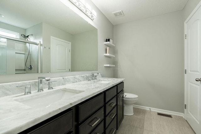 123 Schellinger St, Delaware, OH 43015 - bathroom with double vanity, a shower with shower door, and tile patterned floors