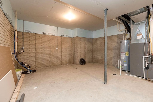 123 Schellinger St, Delaware, OH 43015 - unfinished basement with water heater, brick wall, and heating unit