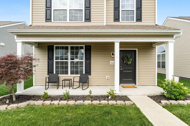 2020 Edison St, Newark, OH 43055 - property entrance featuring a porch and roof with shingles