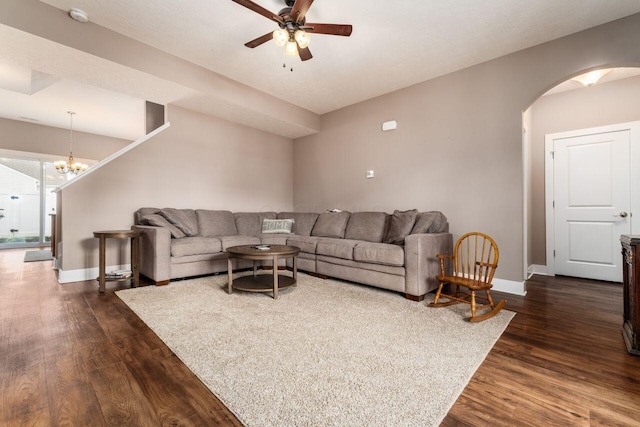 2020 Edison St, Newark, OH 43055 - living room featuring arched walkways, dark wood-style flooring, a ceiling fan, and a chandelier