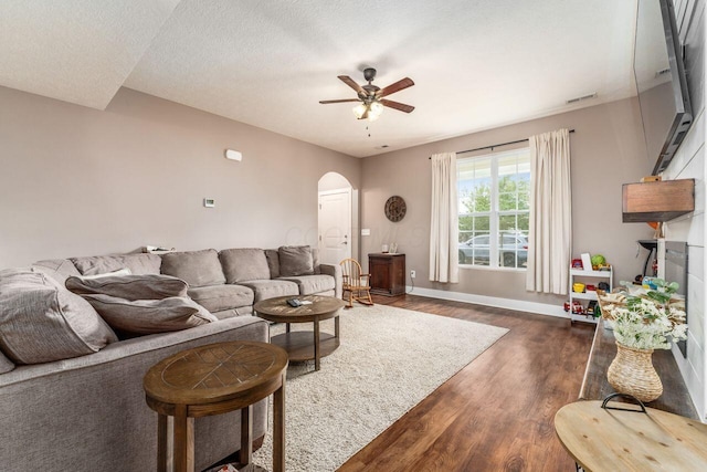 2020 Edison St, Newark, OH 43055 - living room featuring arched walkways, dark wood-style flooring, and a ceiling fan