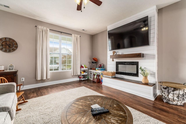 2020 Edison St, Newark, OH 43055 - living area featuring wood finished floors, a ceiling fan, and a fireplace