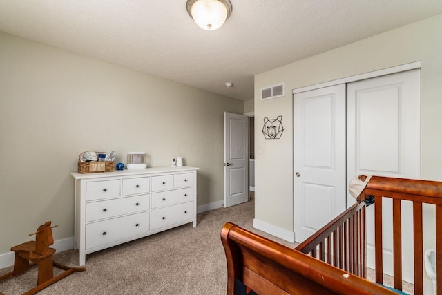 2020 Edison St, Newark, OH 43055 - bedroom featuring light colored carpet, a closet, and a textured ceiling