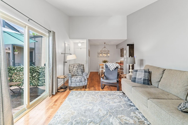 1080 Merrimar Cir S Unit E, Columbus, OH 43220 - living area featuring wood finished floors and a chandelier