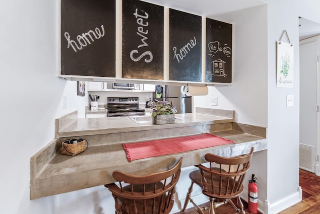 1080 Merrimar Cir S Unit E, Columbus, OH 43220 - bar with stainless steel appliances and wood finished floors