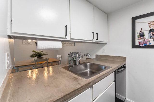 1080 Merrimar Cir S Unit E, Columbus, OH 43220 - kitchen with dishwasher and white cabinets