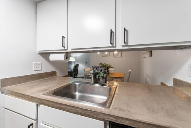 1080 Merrimar Cir S Unit E, Columbus, OH 43220 - kitchen with white cabinetry and a sink