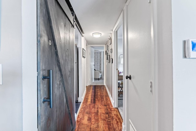 1080 Merrimar Cir S Unit E, Columbus, OH 43220 - hallway featuring dark wood-style flooring and baseboards