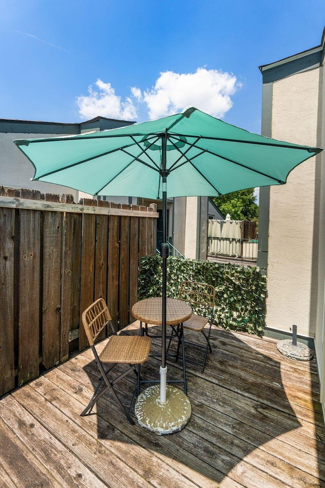 1080 Merrimar Cir S Unit E, Columbus, OH 43220 - wooden deck with outdoor dining space