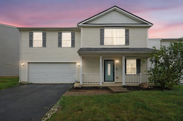 4686 Willowburn Dr, Columbus, OH 43207 - traditional home featuring driveway, a garage, and covered porch