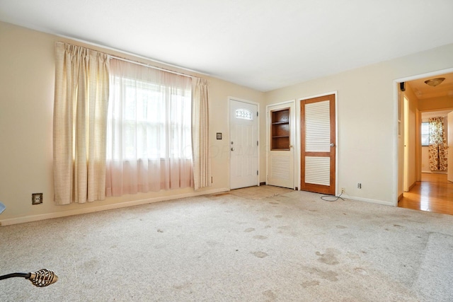 814 Gilmore Dr, Reynoldsburg, OH 43068 - unfurnished living room with carpet and baseboards