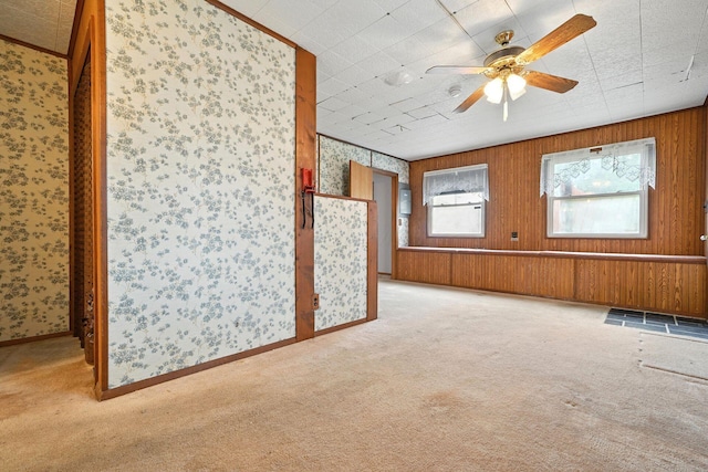 814 Gilmore Dr, Reynoldsburg, OH 43068 - unfurnished living room with wallpapered walls, light colored carpet, and a ceiling fan