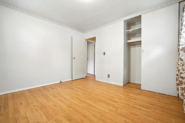 814 Gilmore Dr, Reynoldsburg, OH 43068 - unfurnished bedroom with light wood-type flooring and a closet