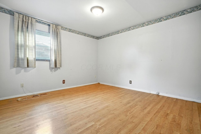 814 Gilmore Dr, Reynoldsburg, OH 43068 - unfurnished room featuring baseboards and wood finished floors