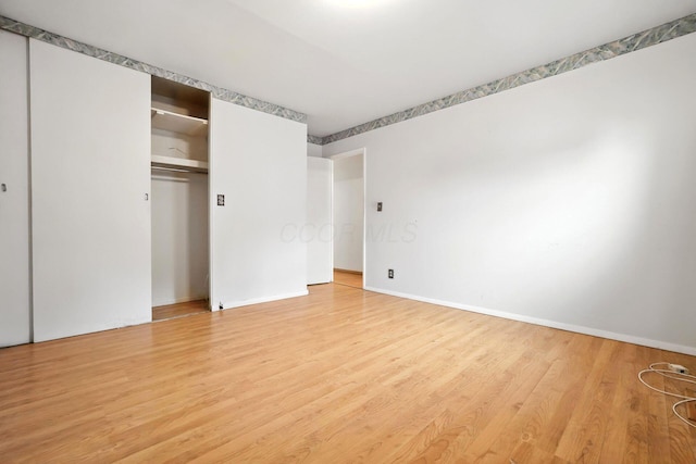 814 Gilmore Dr, Reynoldsburg, OH 43068 - unfurnished bedroom with light wood finished floors and a closet