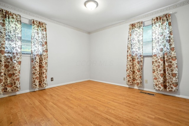 814 Gilmore Dr, Reynoldsburg, OH 43068 - empty room with wood finished floors and baseboards