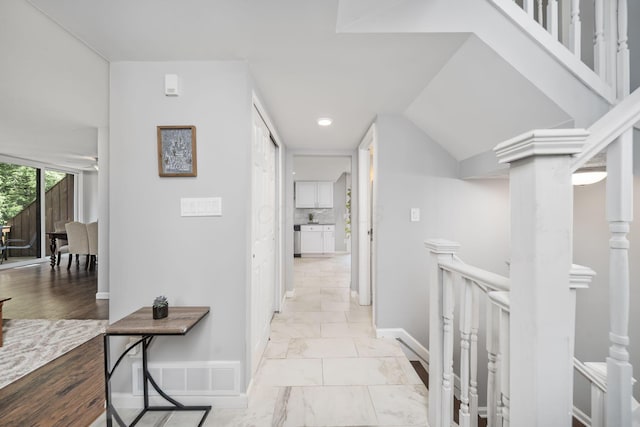 4968 Wintersong Ln Unit 10, Westerville, OH 43081 - hall with an upstairs landing, light marble finish floors, and recessed lighting