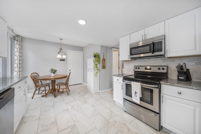 4968 Wintersong Ln Unit 10, Westerville, OH 43081 - kitchen with stainless steel appliances, white cabinets, backsplash, dark stone countertops, and light marble finish floors