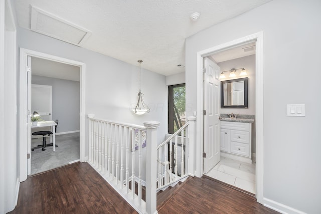 4968 Wintersong Ln Unit 10, Westerville, OH 43081 - corridor with an upstairs landing, wood finished floors, an office area, and attic access