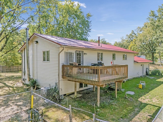 4250 Herr Fieldhouse Rd, Southington, OH 44470 - back of property featuring a wooden deck, a metal roof, and a fenced backyard