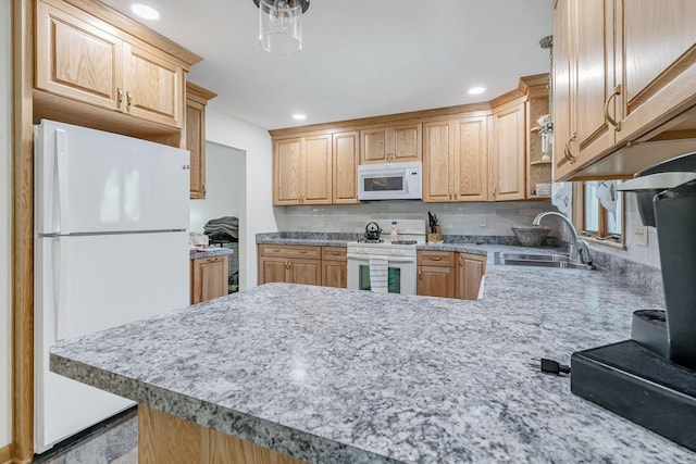 4250 Herr Fieldhouse Rd, Southington, OH 44470 - kitchen featuring white appliances, light countertops, a peninsula, decorative backsplash, and recessed lighting