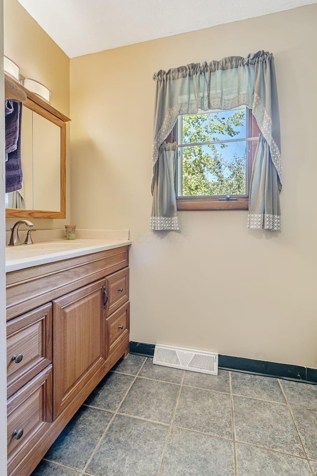4250 Herr Fieldhouse Rd, Southington, OH 44470 - bathroom with vanity and baseboards