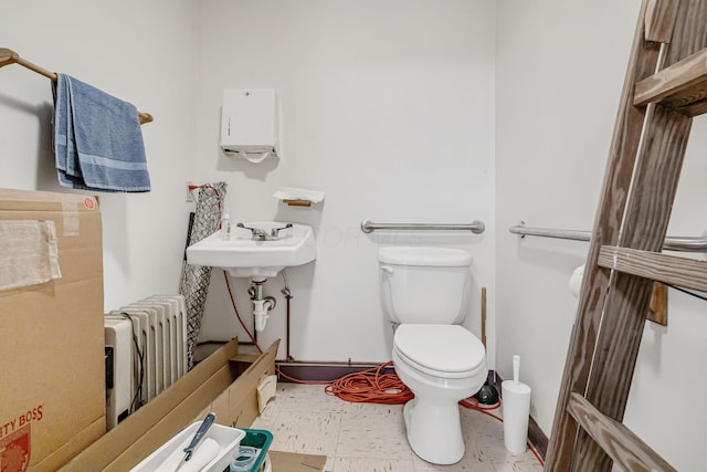 4250 Herr Fieldhouse Rd, Southington, OH 44470 - half bathroom with radiator heating unit and toilet