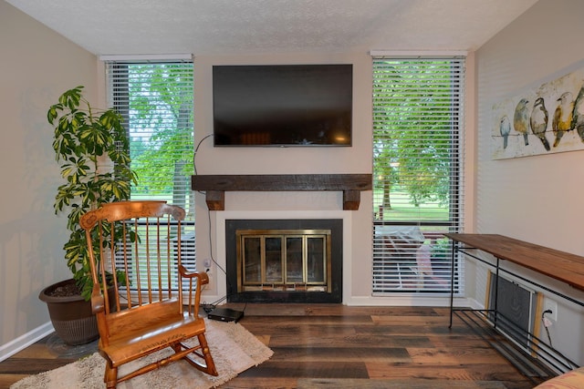 4883 Powderhorn Ln Unit 3, Westerville, OH 43081 - living room with a glass covered fireplace, wood finished floors, and a textured ceiling