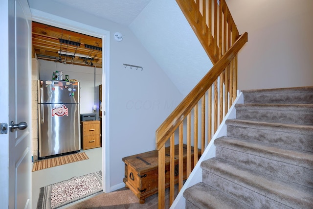 4883 Powderhorn Ln Unit 3, Westerville, OH 43081 - stairway with carpet flooring and vaulted ceiling