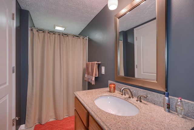 4883 Powderhorn Ln Unit 3, Westerville, OH 43081 - bathroom featuring a textured ceiling, vanity, and a shower with curtain