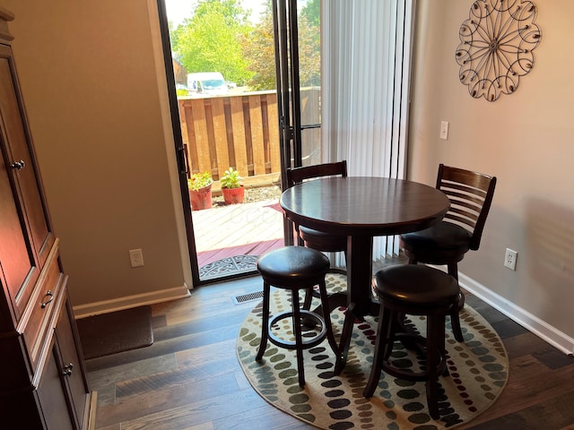 4883 Powderhorn Ln Unit 3, Westerville, OH 43081 - dining room featuring baseboards and dark wood-type flooring