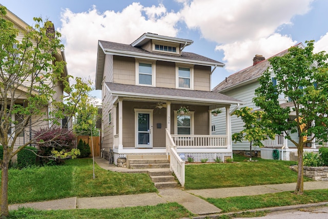 338 Sheldon Ave, Columbus, OH 43207 - traditional style home with covered porch, a front lawn, and roof with shingles