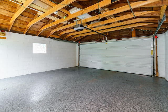 338 Sheldon Ave, Columbus, OH 43207 - garage with concrete block wall and a garage door opener