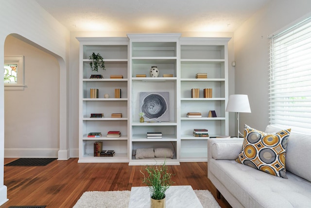 338 Sheldon Ave, Columbus, OH 43207 - living room featuring wood finished floors and arched walkways