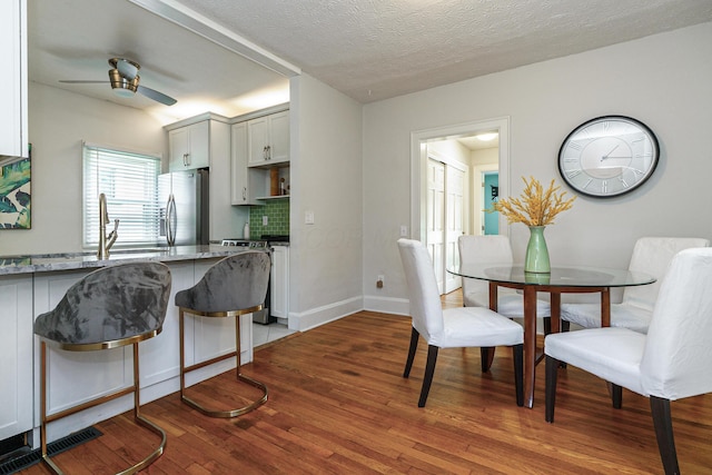338 Sheldon Ave, Columbus, OH 43207 - dining area with a ceiling fan, hardwood / wood-style floors, and a textured ceiling