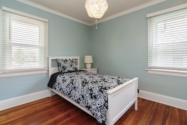 338 Sheldon Ave, Columbus, OH 43207 - bedroom with wood finished floors, ornamental molding, and multiple windows