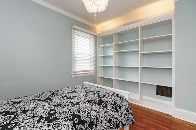 338 Sheldon Ave, Columbus, OH 43207 - bedroom with wood finished floors, crown molding, and a chandelier