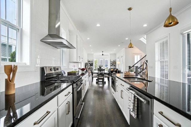 1877 Poplar Pl, Lewis Center, OH 43035 - kitchen featuring stainless steel appliances, wall chimney exhaust hood, decorative backsplash, pendant lighting, and recessed lighting